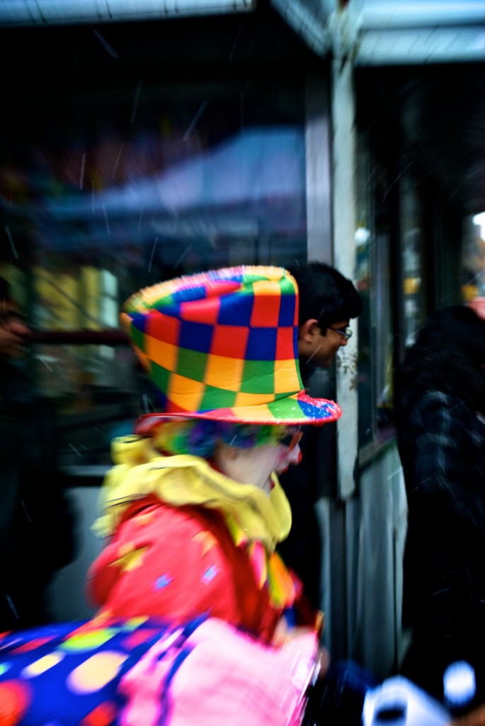 Clown on the move at Yorkville IceFest on Cumberland Street, Toronto 2011-02-26