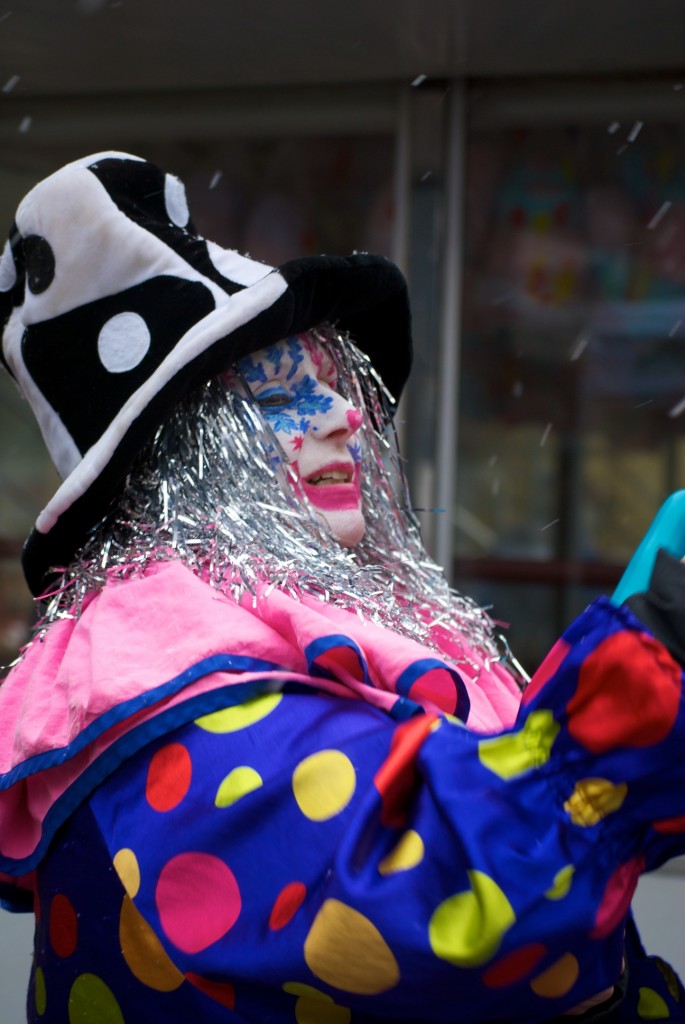 Bustling clown at Yorkville IceFest on Cumberland Street, Toronto 2011-02-26