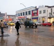 Walking in the rain on Danforth Avenue near Carlaw Avenue, Toronto 2011-03-05