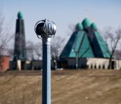 Wind turbine in Riverdale Park with Ukrainian Catholic Church in the background on Broadview Avenue, Toronto 2011-03-29