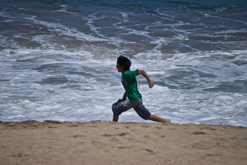 Child running on the beach in Viña del Mar, Chile 2012-01-07