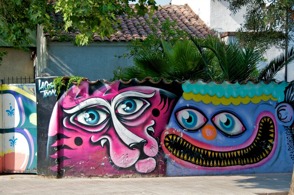 Murial of large faces in Barrio Bellavista in Santiago, Chile 2010-12-17